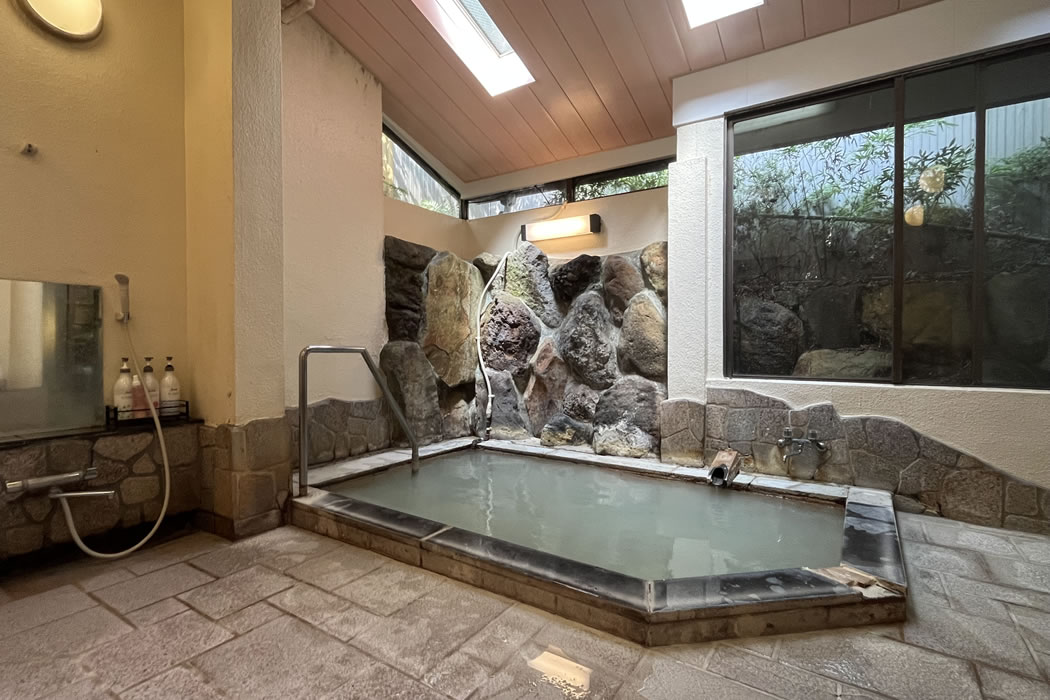 Stone-lined indoor bath.