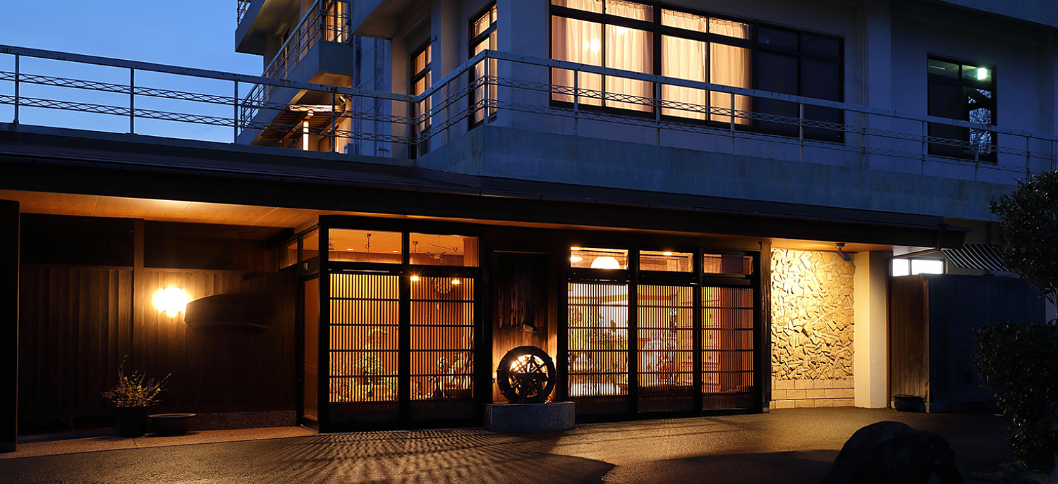 Its warmly illuminated timber entrance after dark.