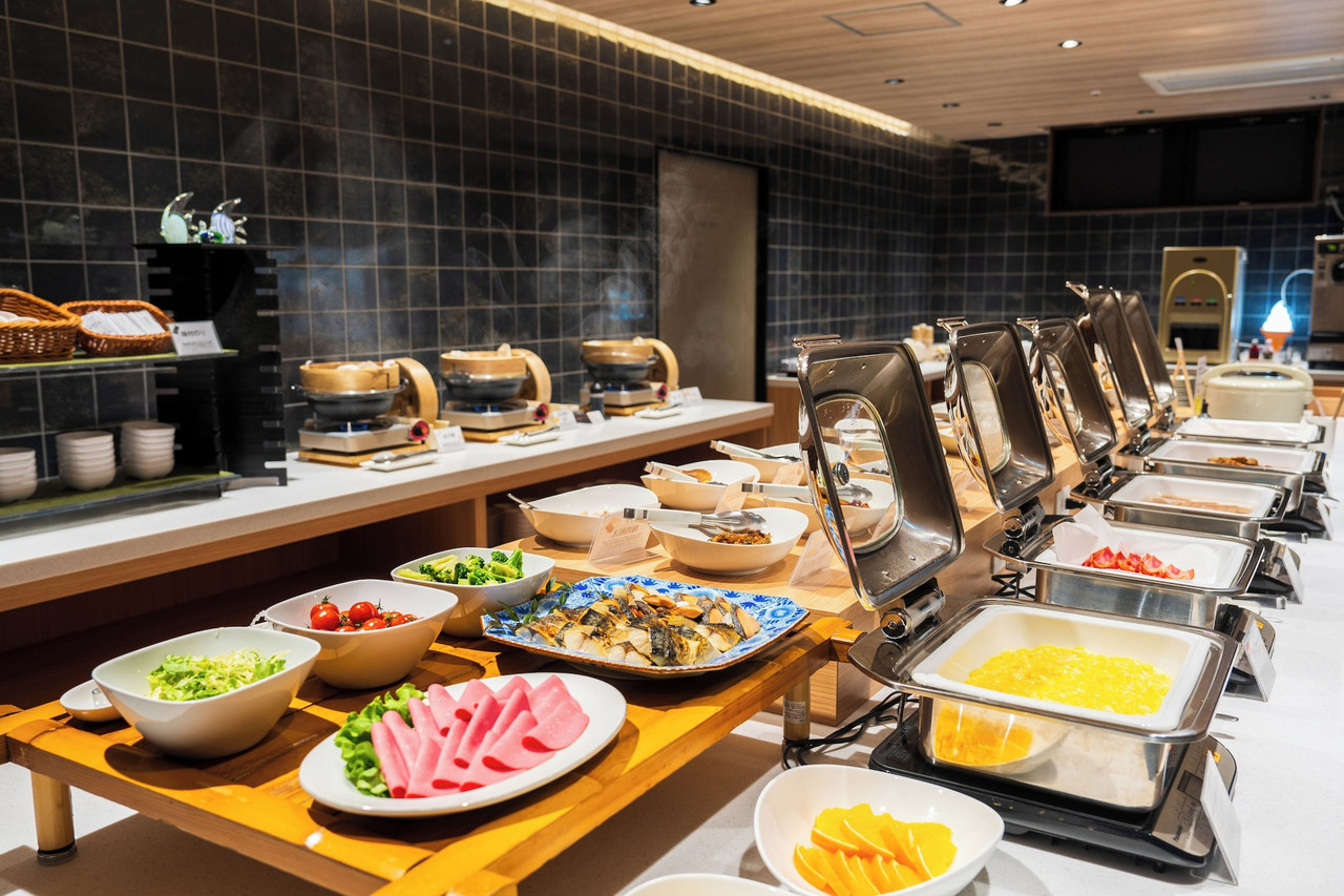 Buffet counter with plated dishes.