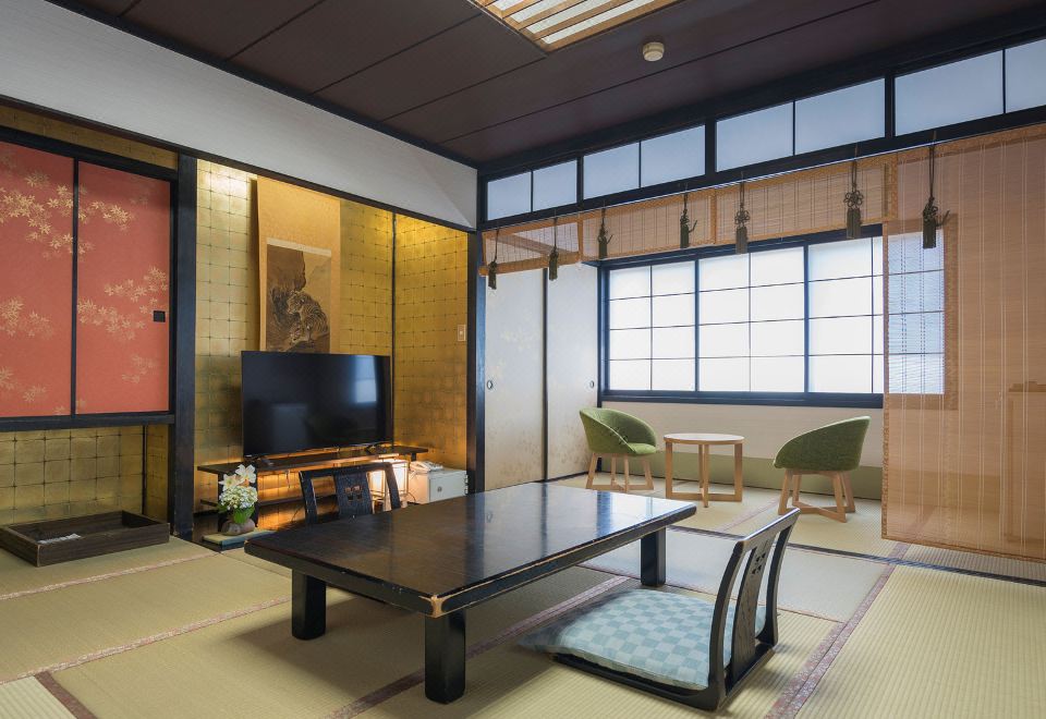 A traditional room opens toward a bright window and low table.