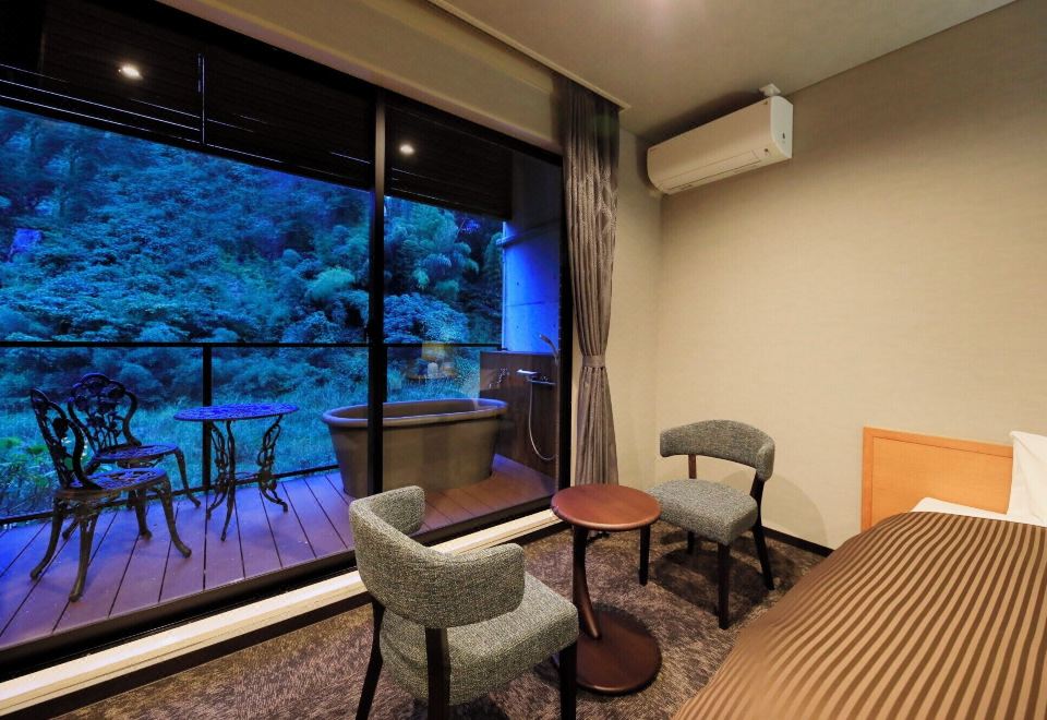 A sitting area beside a blue-lit aquarium window.