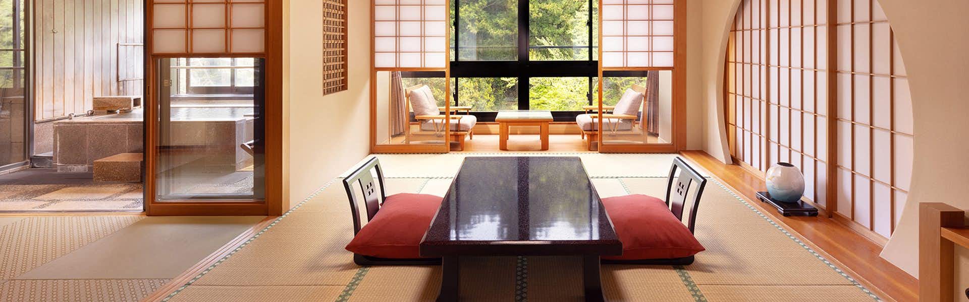 Kagari Kisshotei with a sunlit tatami room with dark low table.