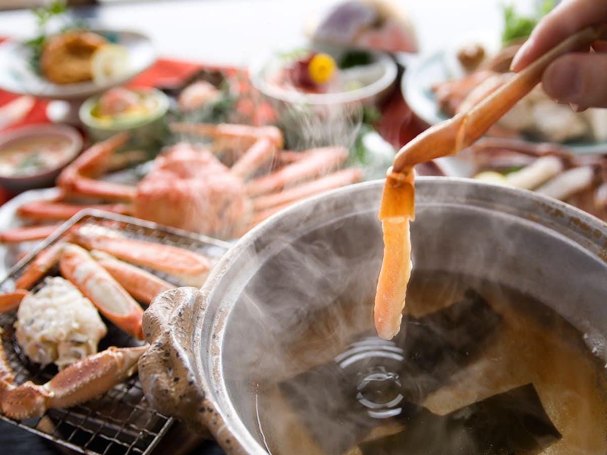 Ryokan Heisei with crab legs simmering in a steaming tabletop hotpot.