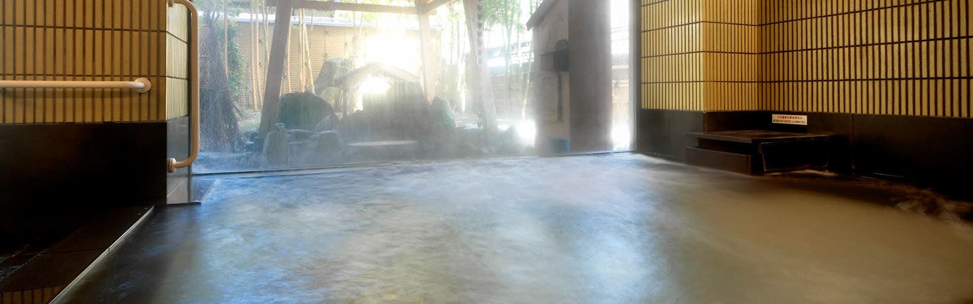Echigo no Oyado Wakatake with a spacious indoor bath with broad windows and tiled walls.