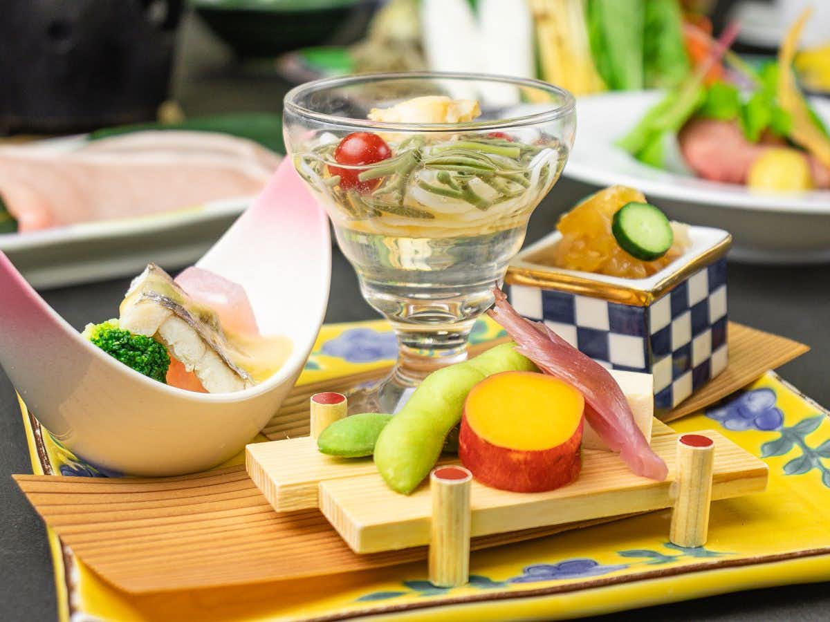Forest Resort Yunonosato Sugina with delicate seasonal appetizers arranged on a lacquered tray.