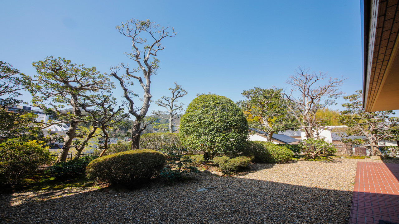 Garden entrance and landscaped grounds.