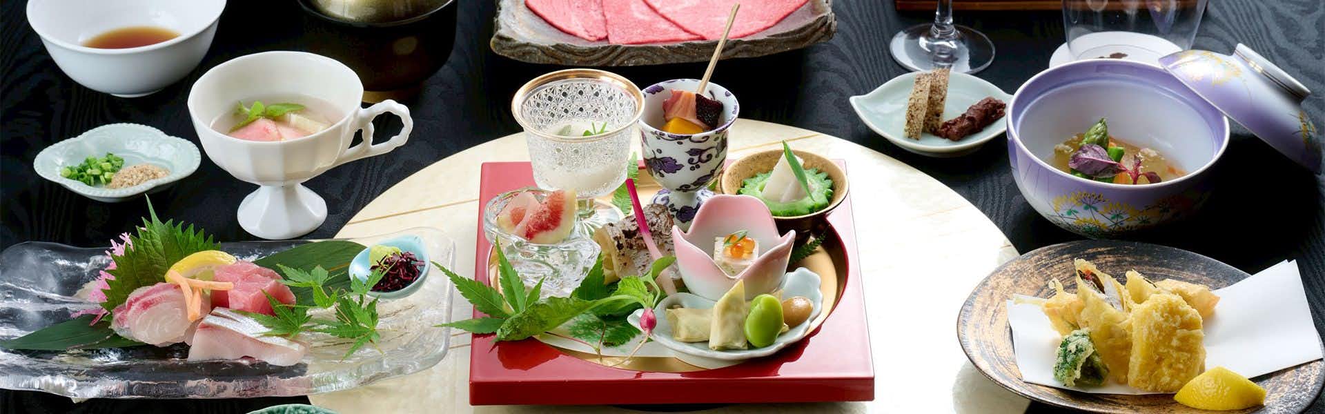 Ryotei Matsuya Honkan Suizenji with a seasonal Japanese dinner arranged across elegant white dishes.