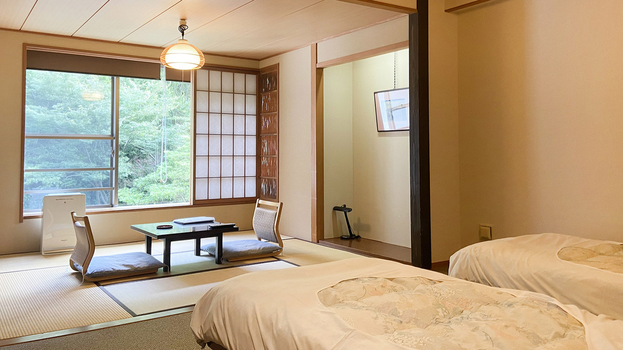 Guest room with seating and a window.
