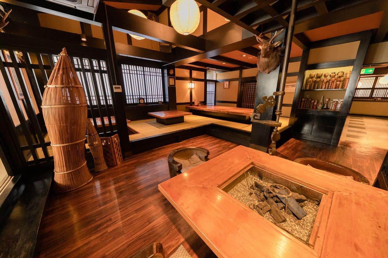 Bardenya Soho with a rustic timber lounge centered on a sunken hearth.