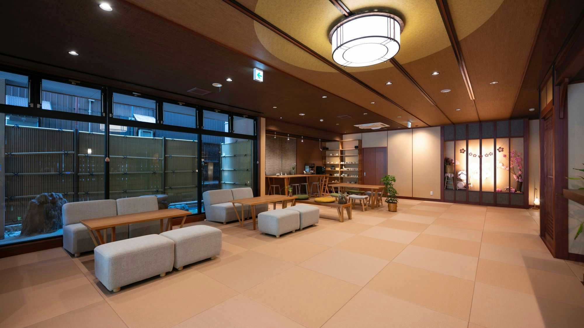 Kappo Inn Sakuraya with a broad modern lobby with pale sofas and geometric ceiling lights.