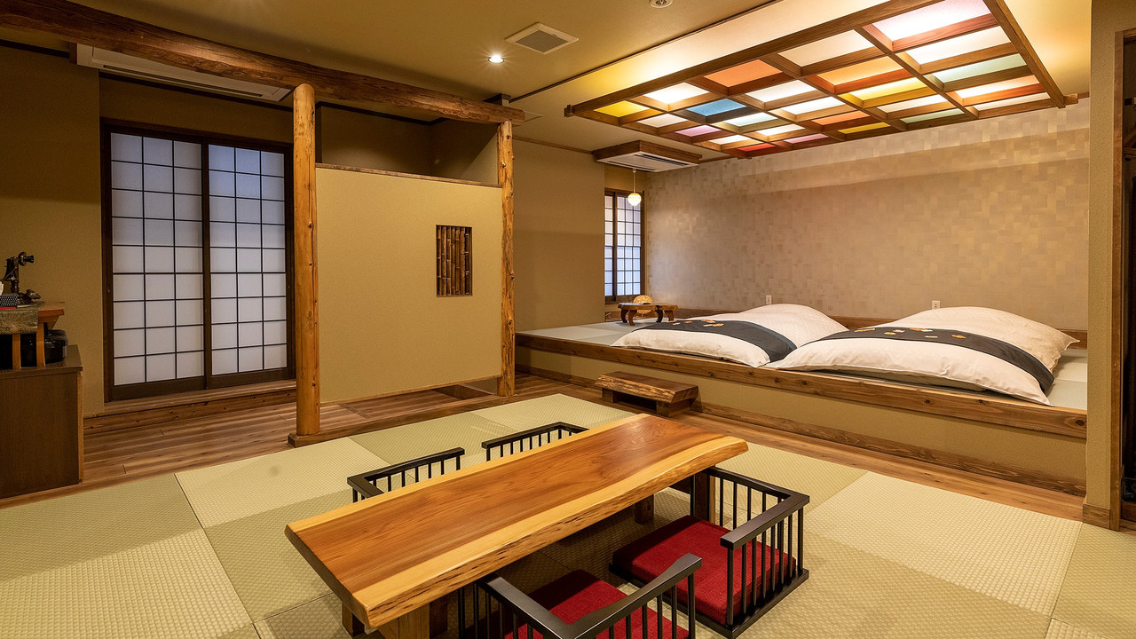A traditional room with beds and a low table.
