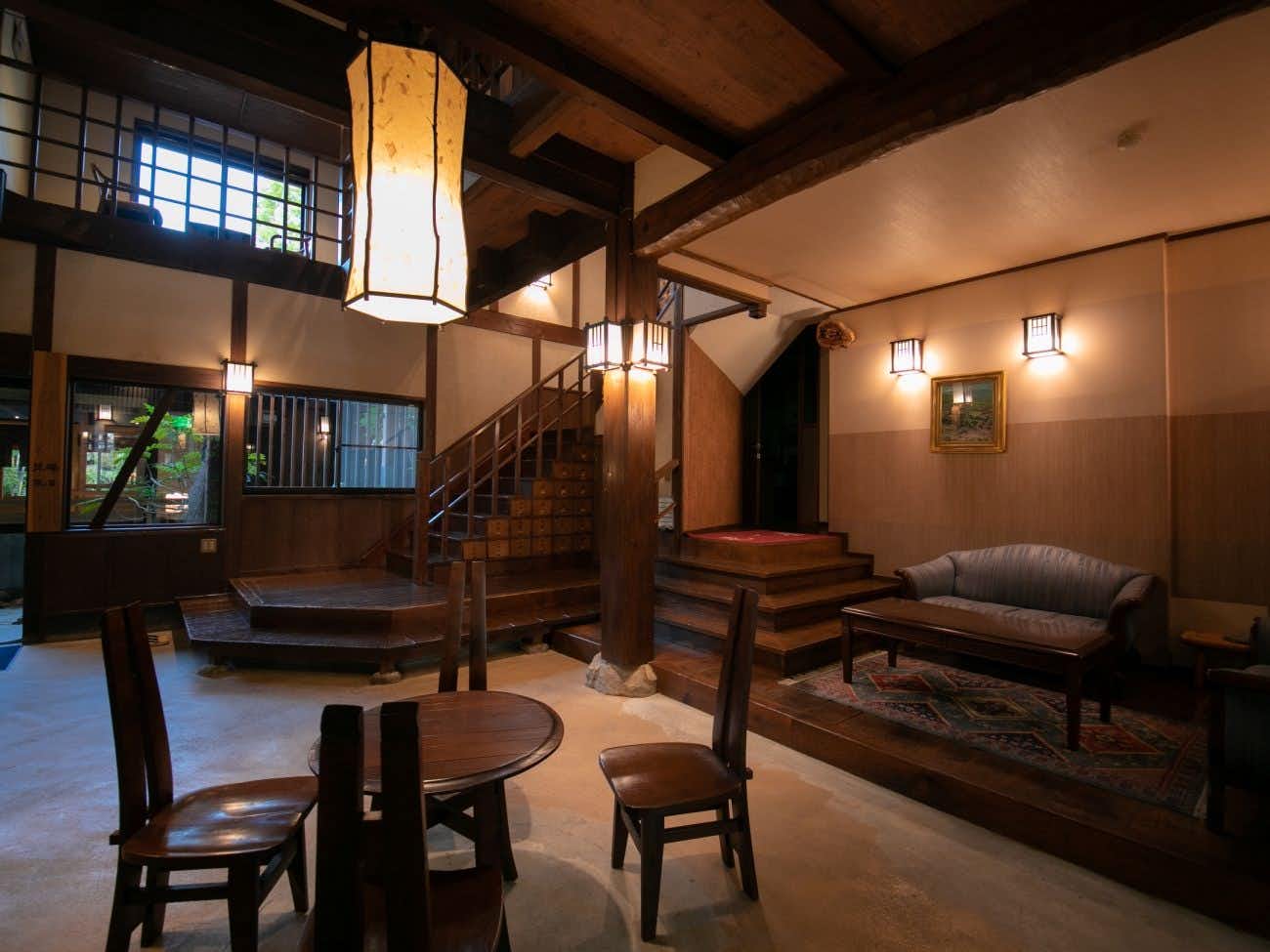 Fukinoya timber lobby with stairs, lanterns and lounge chairs