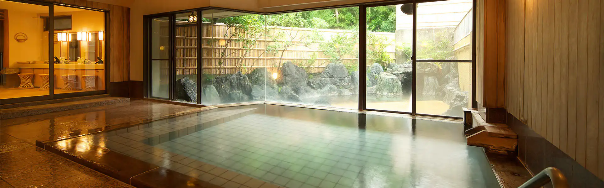 Daichi no Irodori Kagetsutei with this scene, where its large indoor bath looks onto a stone garden through broad windows.
