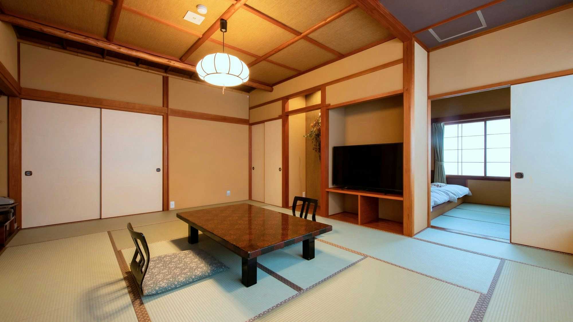 Kappo Inn Sakuraya with a tatami guest room with low table and adjoining bedroom.