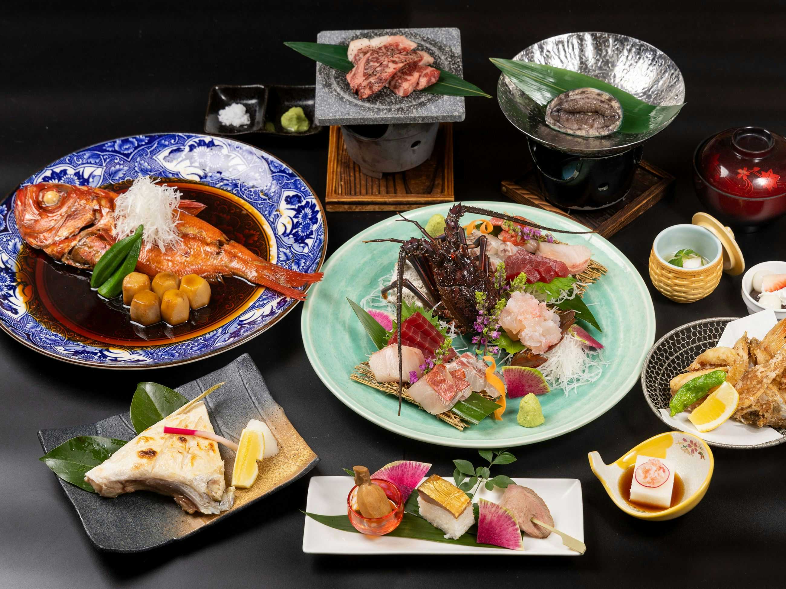 Hotel Yoshino with sashimi and grilled beef presented with colorful seasonal dishes.