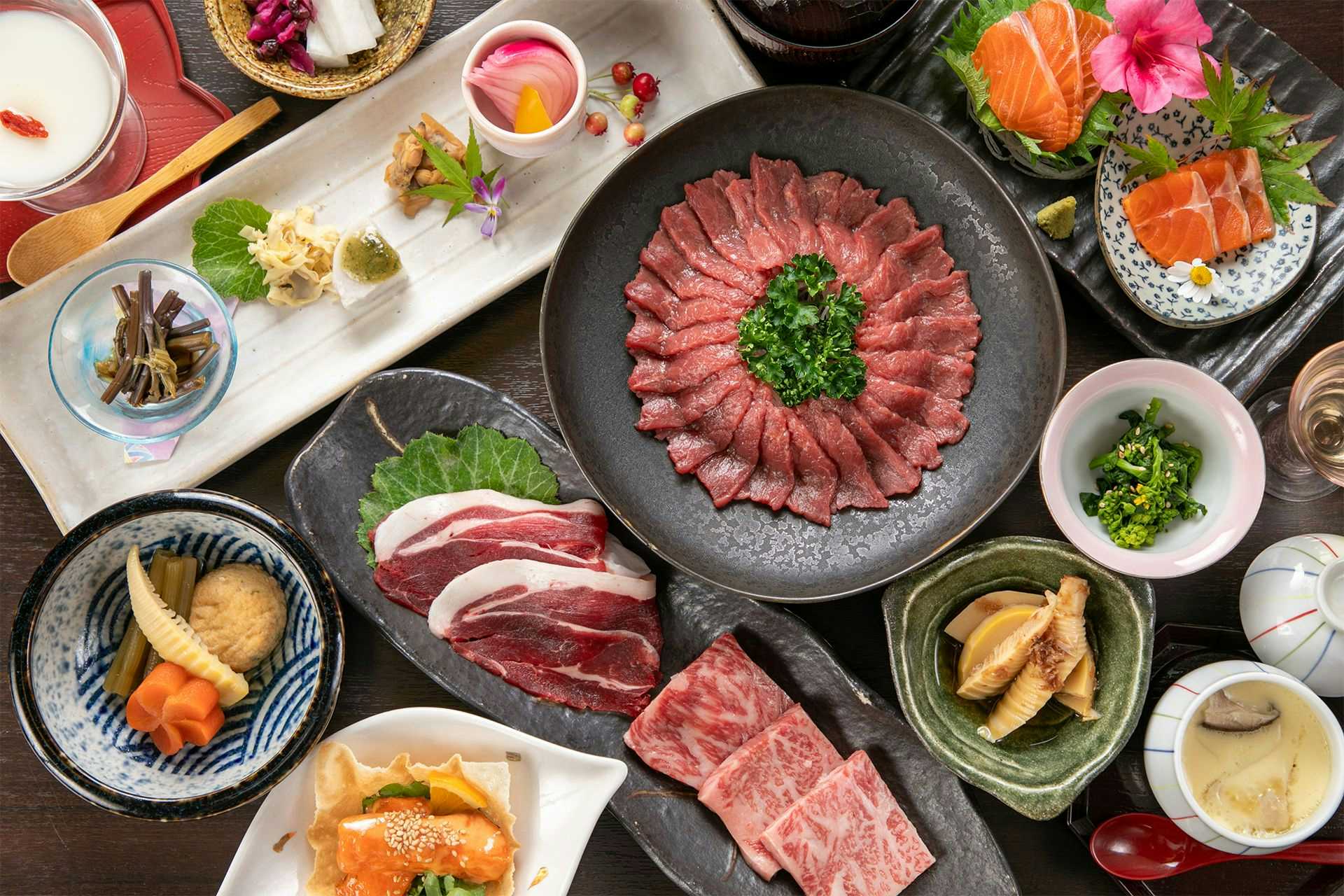 Isamikan a prepared meal spread arranged across bowls and plates.
