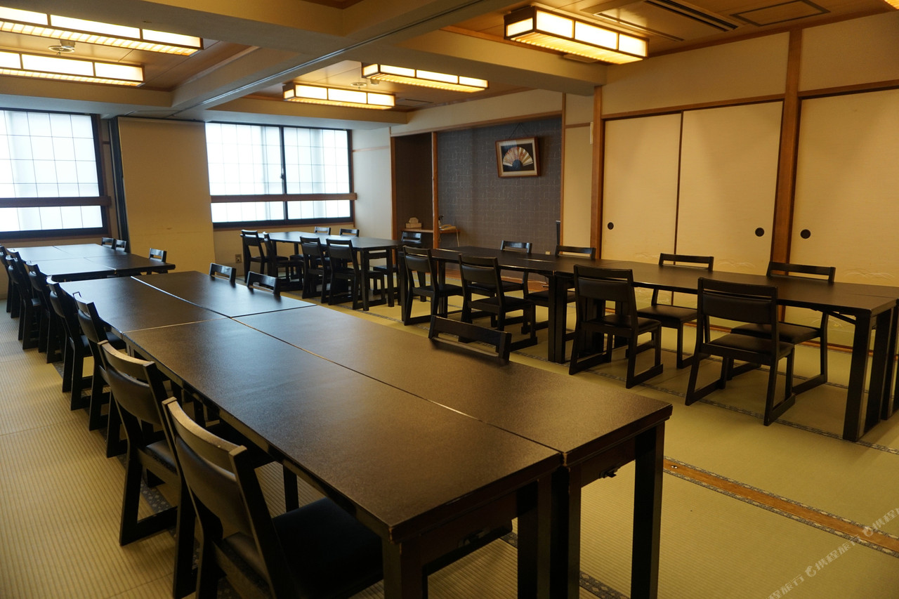 A dining room with long tables.