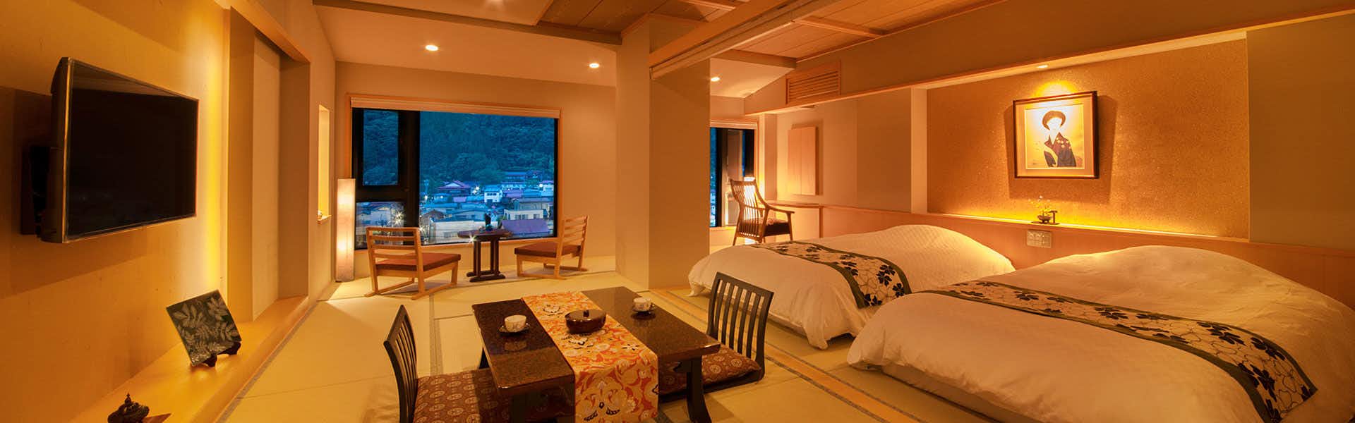 Yamamizuki URARA Tsutaya with a spacious contemporary guest room featuring twin beds and warm lighting.