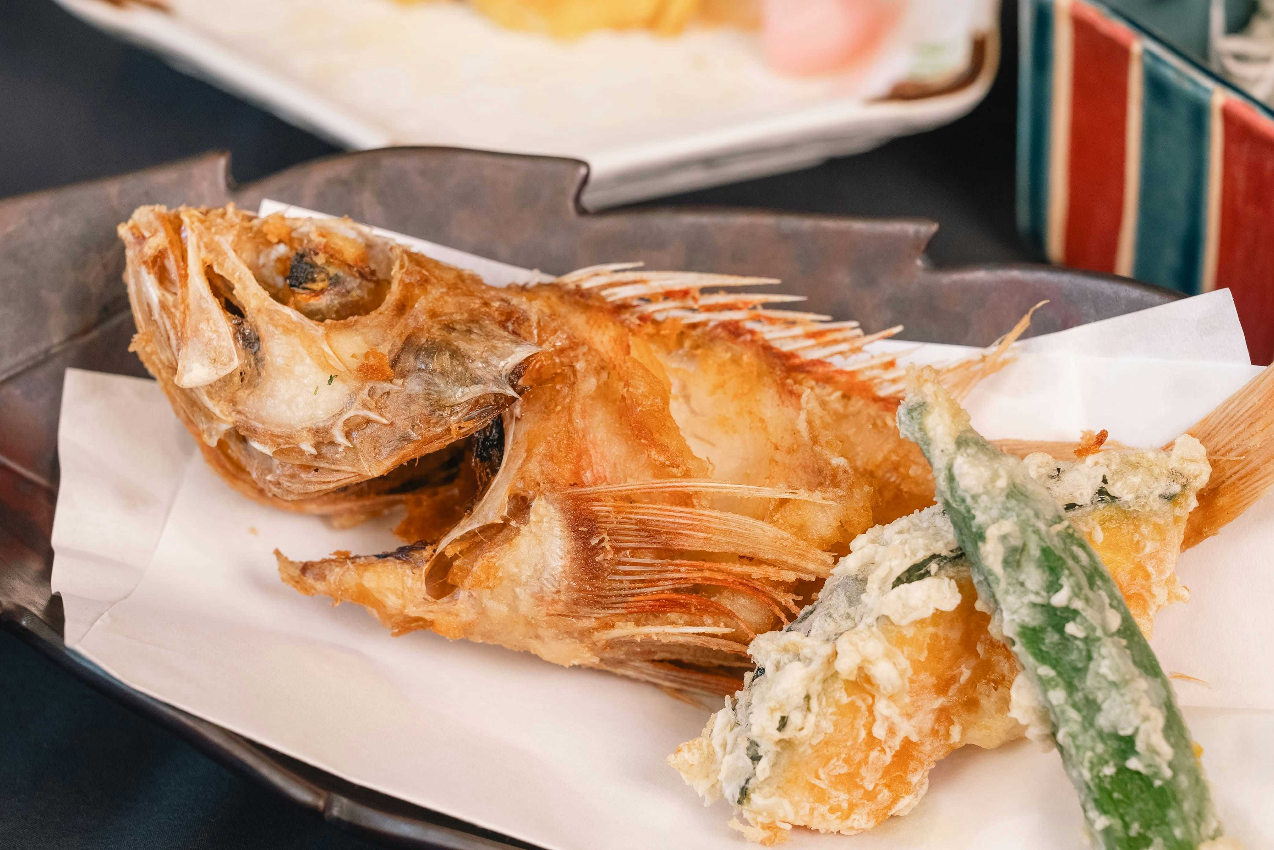 Oyado Uoki with a fried whole fish served with vegetables and tempura.
