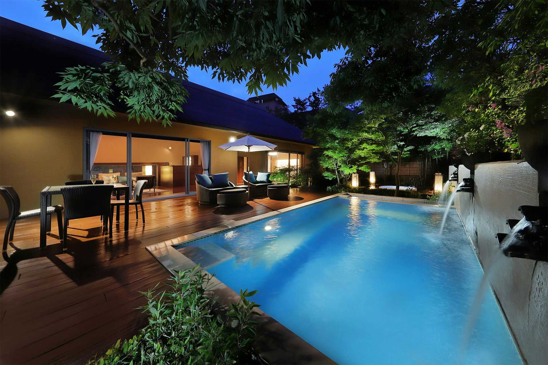 Bettei La-Shoro with this scene, where a blue private pool borders a timber terrace and outdoor dining table.