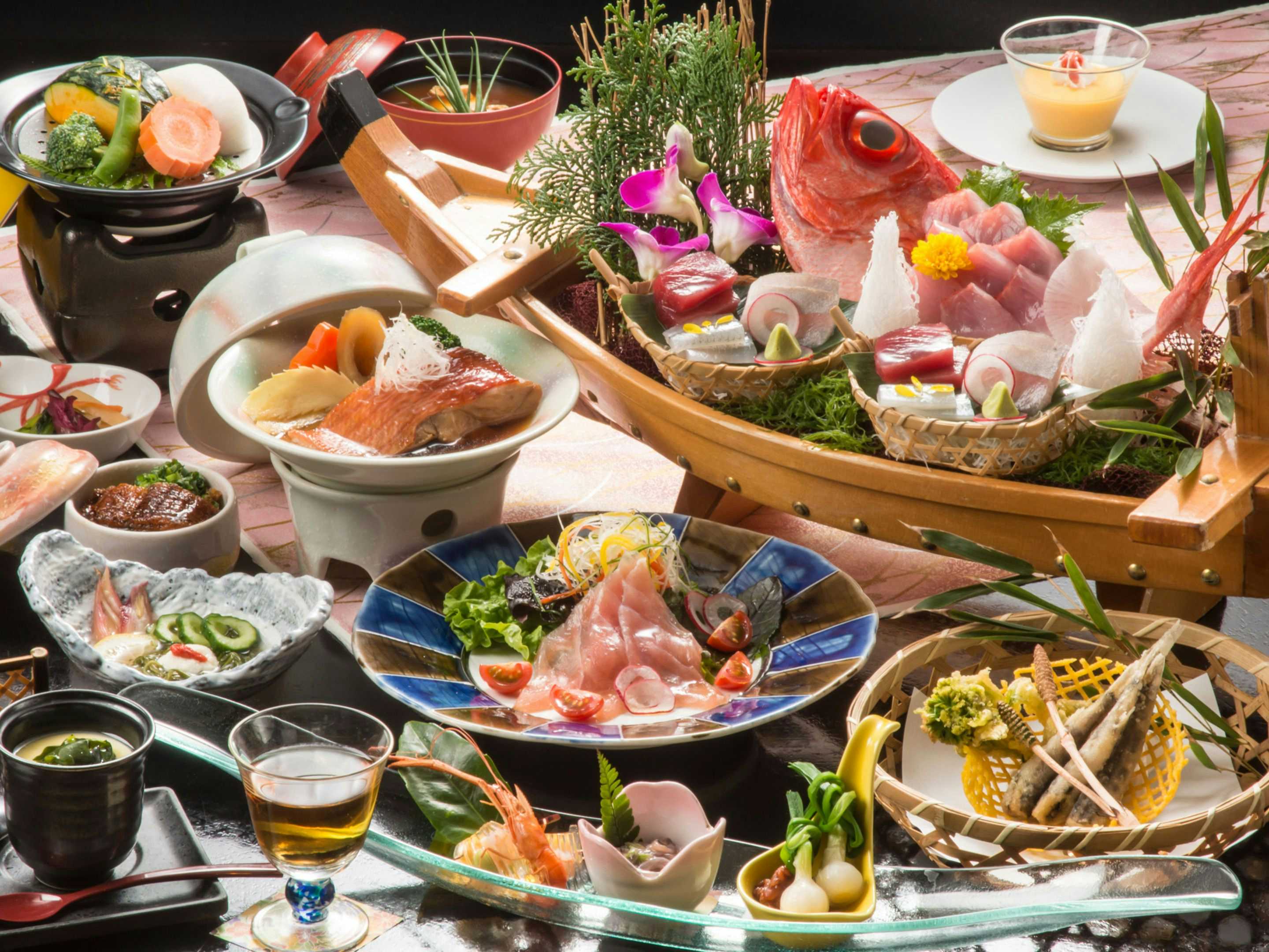 Seiryu Seaside Sunset Onsen Ryokan with an elaborate seafood dinner centered on a whole red fish.