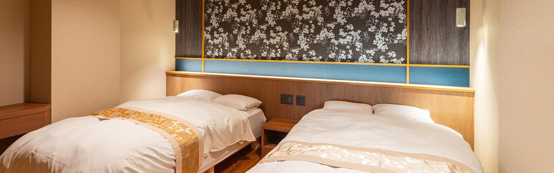 Biwako Lakeside Gourmet Inn Futabasou with a twin guest room overlooking broad blue lake water.