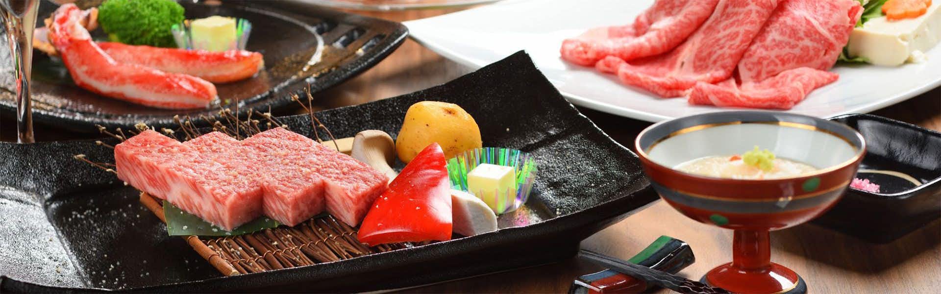 Shikikan Saito with marbled beef slices presented with colorful seasonal vegetables.