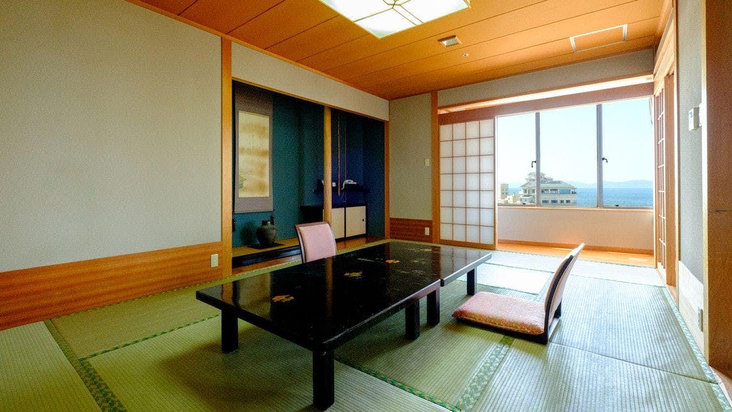 Fuyo Annex with a bright tatami guest room overlooking the coastal town.