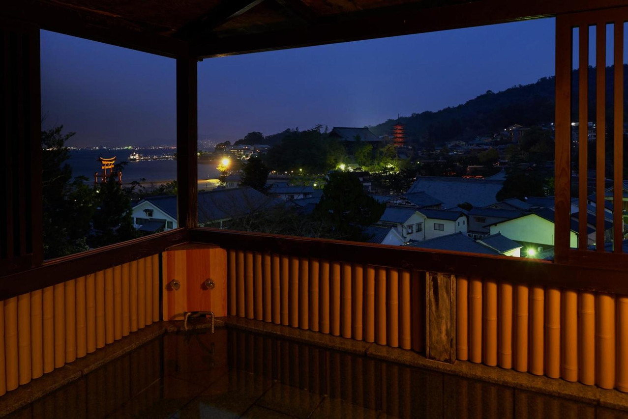 Terrace bath overlooking nearby lights.