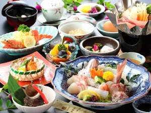 Tsutaya Ryokan large meal spread arranged across colorful plates and bowls