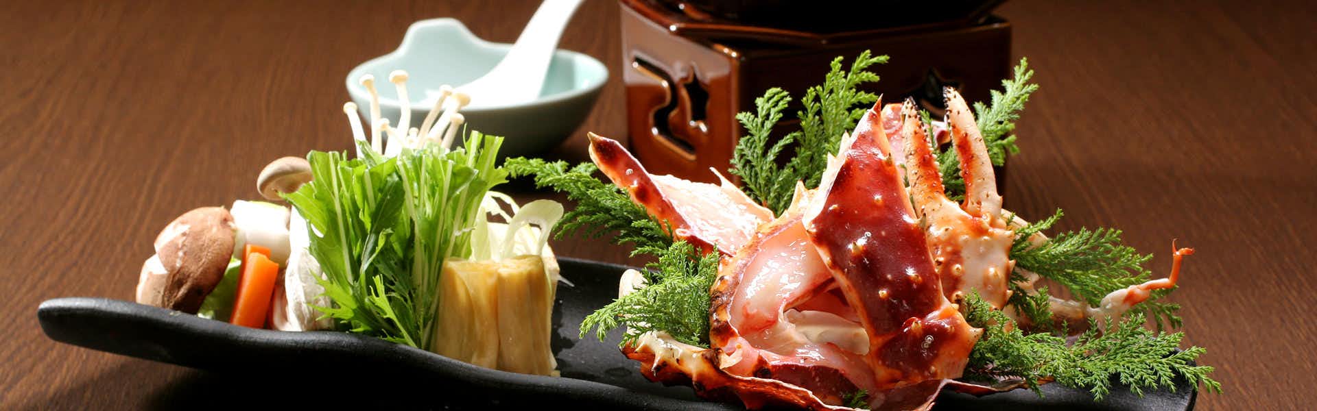 Meiseki no Yado Kagetsu with lobster sashimi presented with mushrooms, greens, and crushed ice.