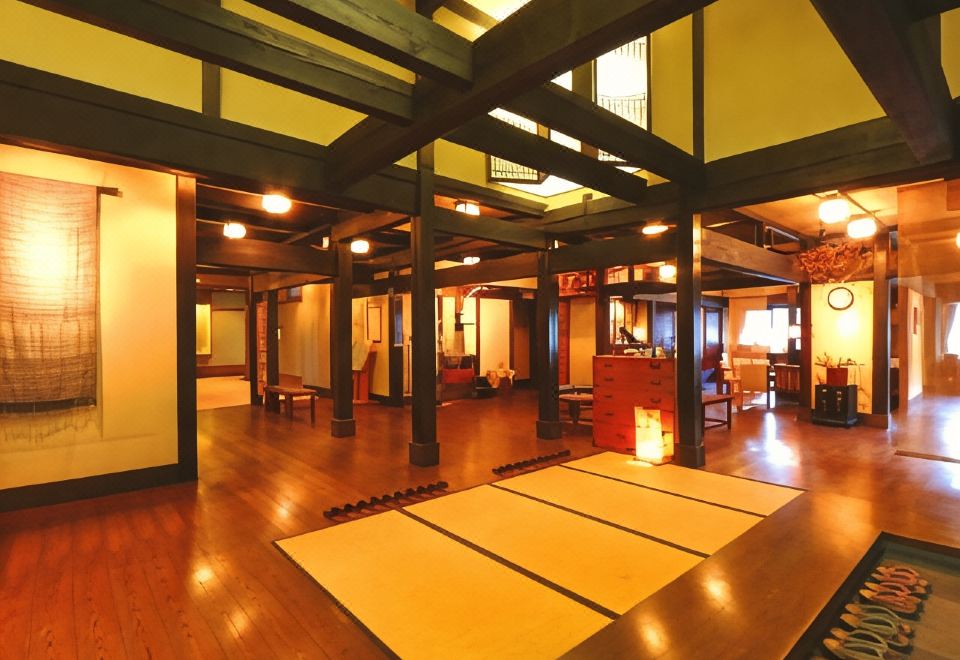 A wood-lined interior opens onto a traditional Japanese room.