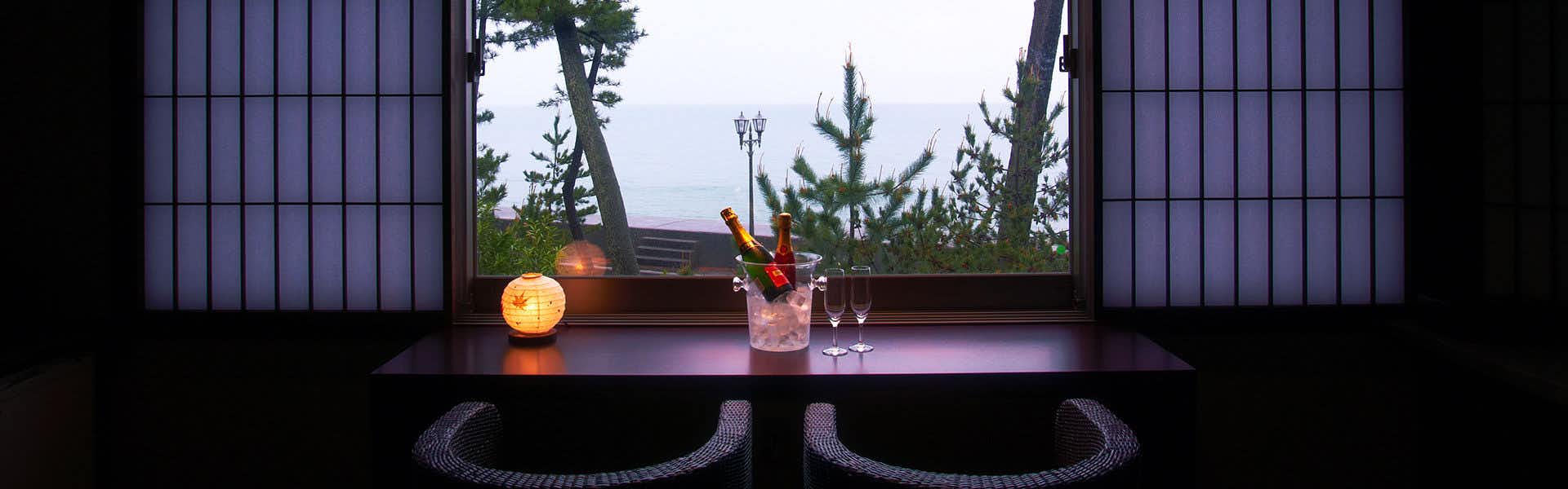 Seaside Inn Hamachiyo-kan with a quiet window alcove with a single flower arrangement.