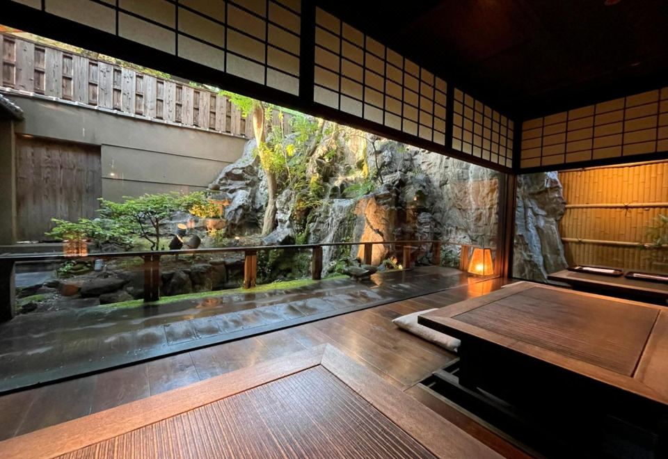 A dining room opening onto a garden view.