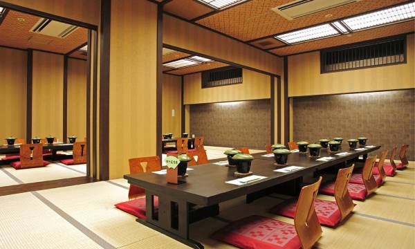 A Japanese dining room set with low tables.