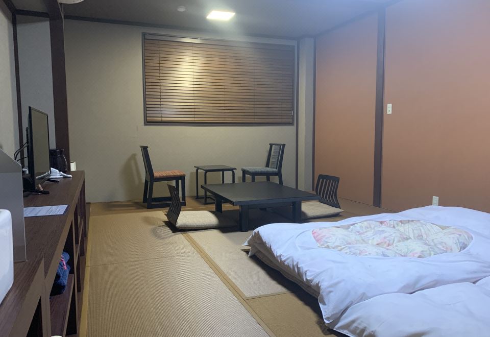 Tatami room with futon bedding.