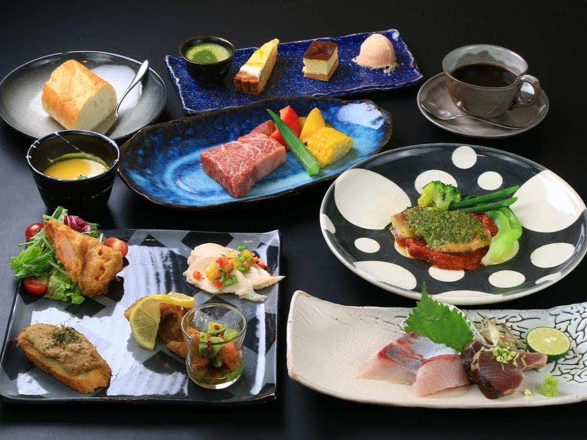 A colorful dinner with sashimi, steak, and plated appetizers.