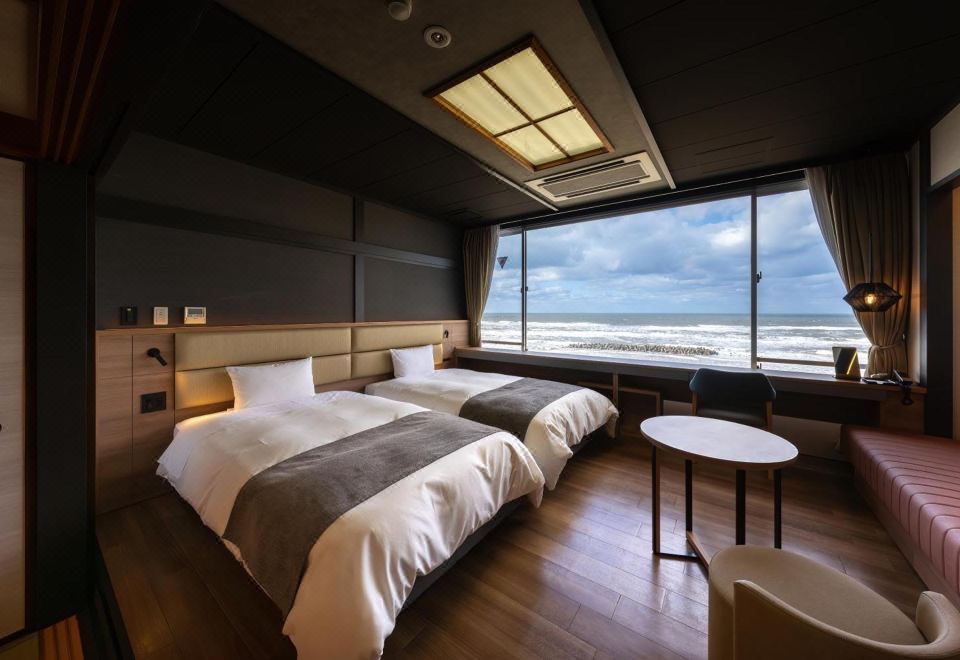 A modern twin room with an ocean view.