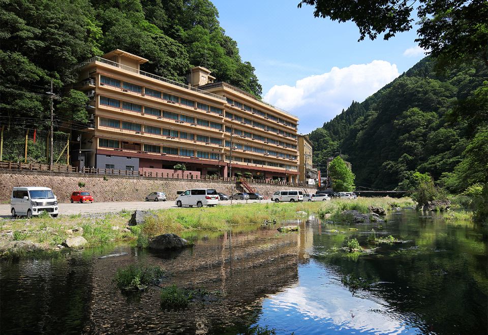 A hotel building beside the river.