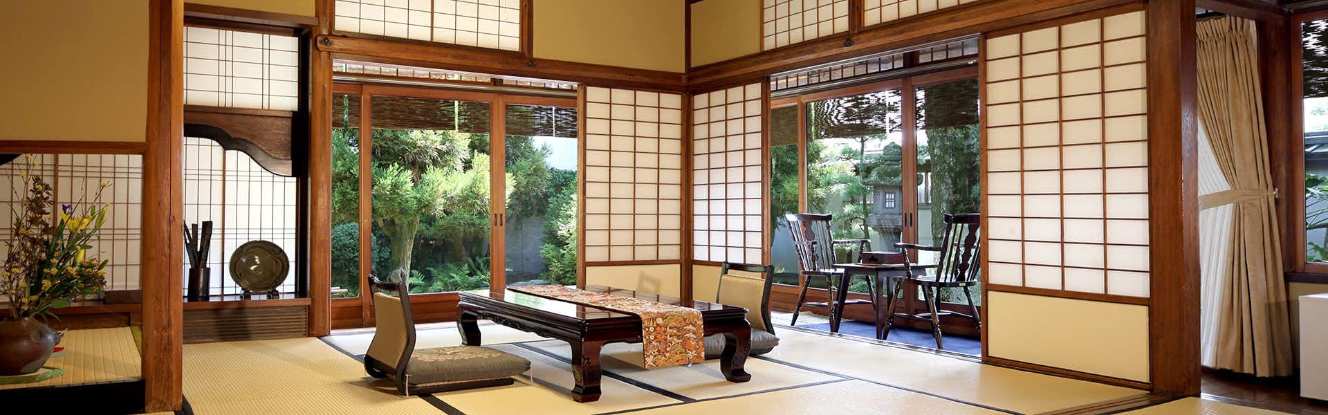 Ryokan Tsurugata with a refined tatami room opening toward a green courtyard.