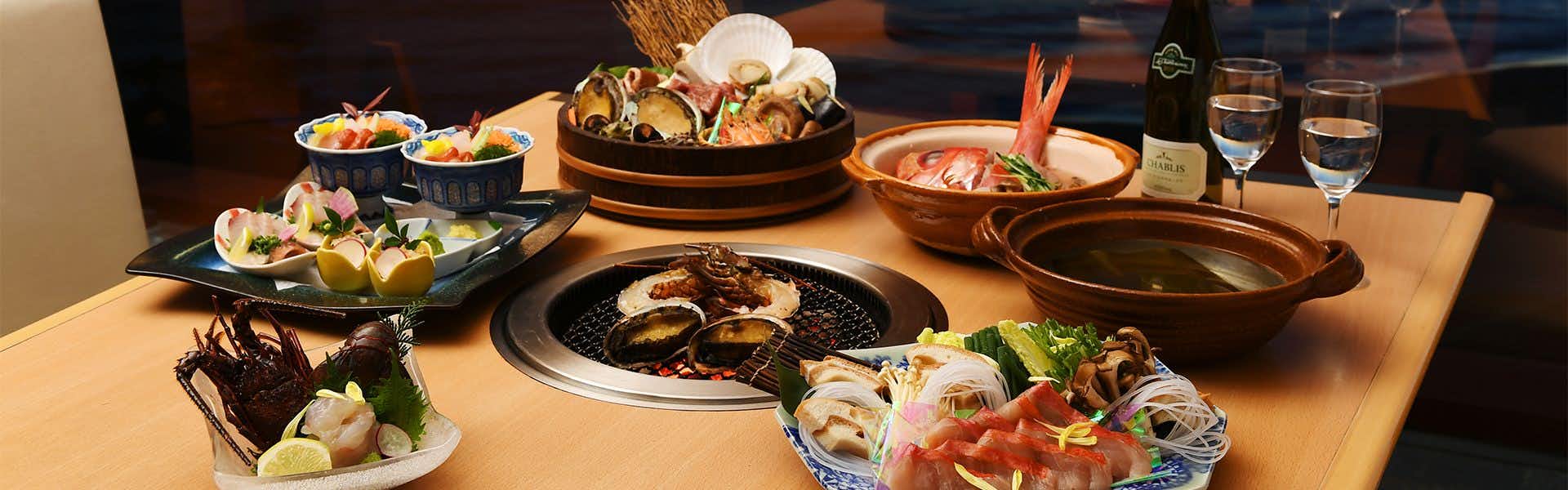 Izu Shimoda Onsen Shimoda Yamatokan with a seafood dinner arranged across numerous seasonal dishes.