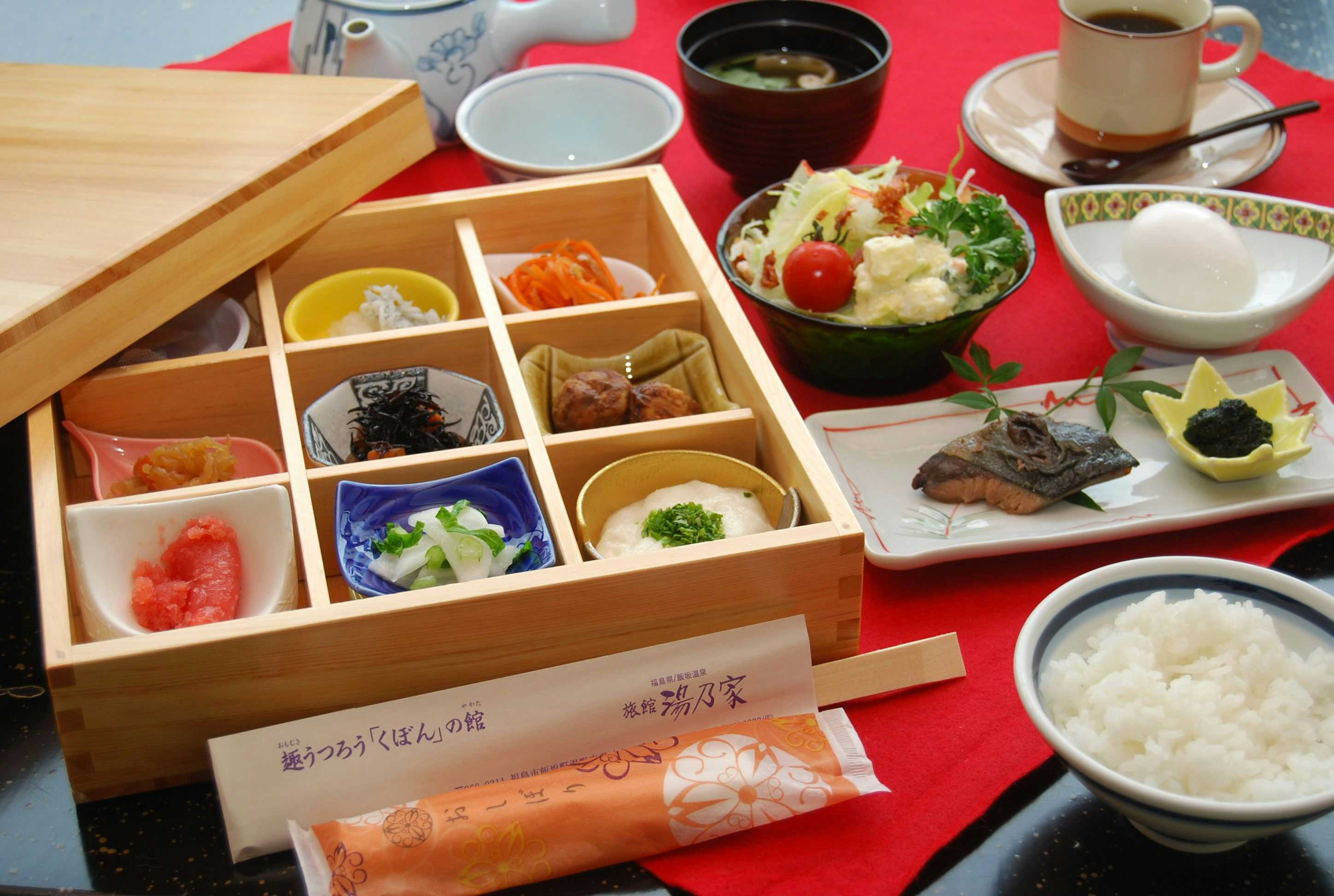 Ryokan Yunoya with a Japanese breakfast arranged inside a compartmented timber box.