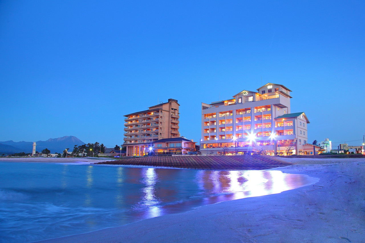 A hotel building beside the water.