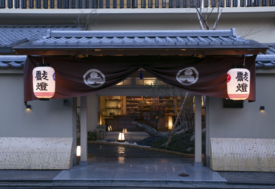 A traditional ryokan entrance at dusk.