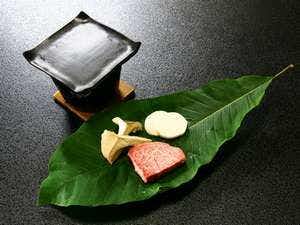 Nakajimaya Ryokan with seared beef cubes presented on a green leaf.