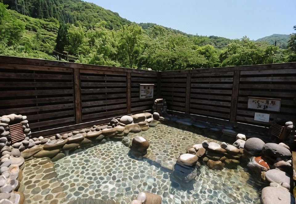 A private rock-lined outdoor bath.