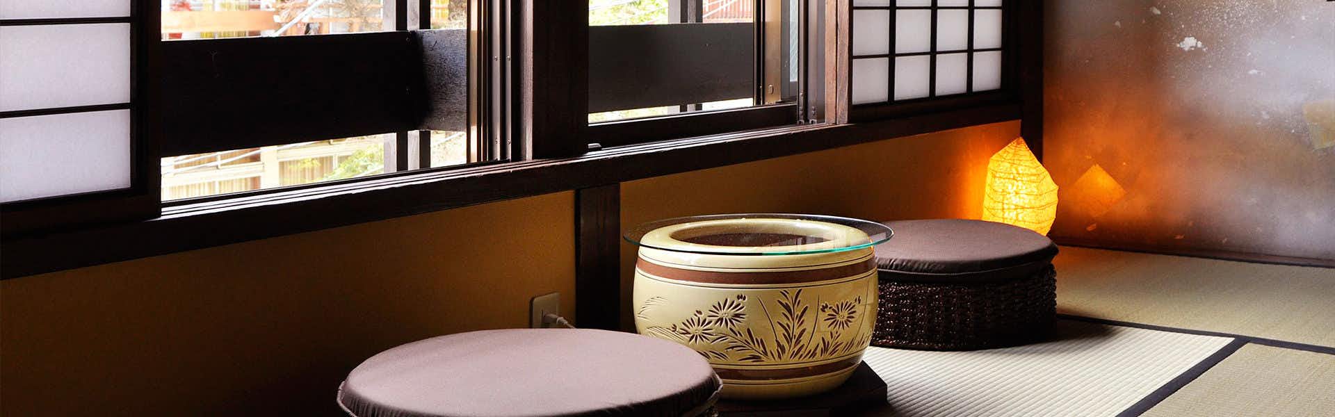 Yudanaka Onsen Wafu no Yado Masuya tatami sitting area with floor cushions and a round ceramic basin beside windows