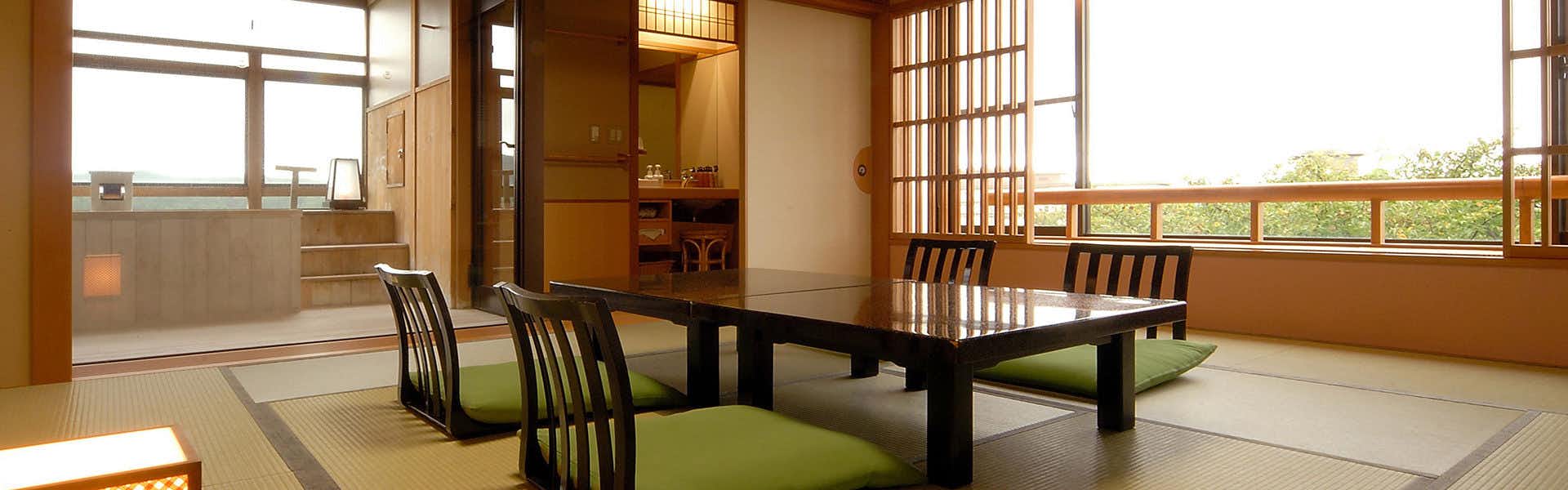 Yunoyado Hakusan Shobutei with this scene, where a panoramic tatami room faces broad windows and low seating.