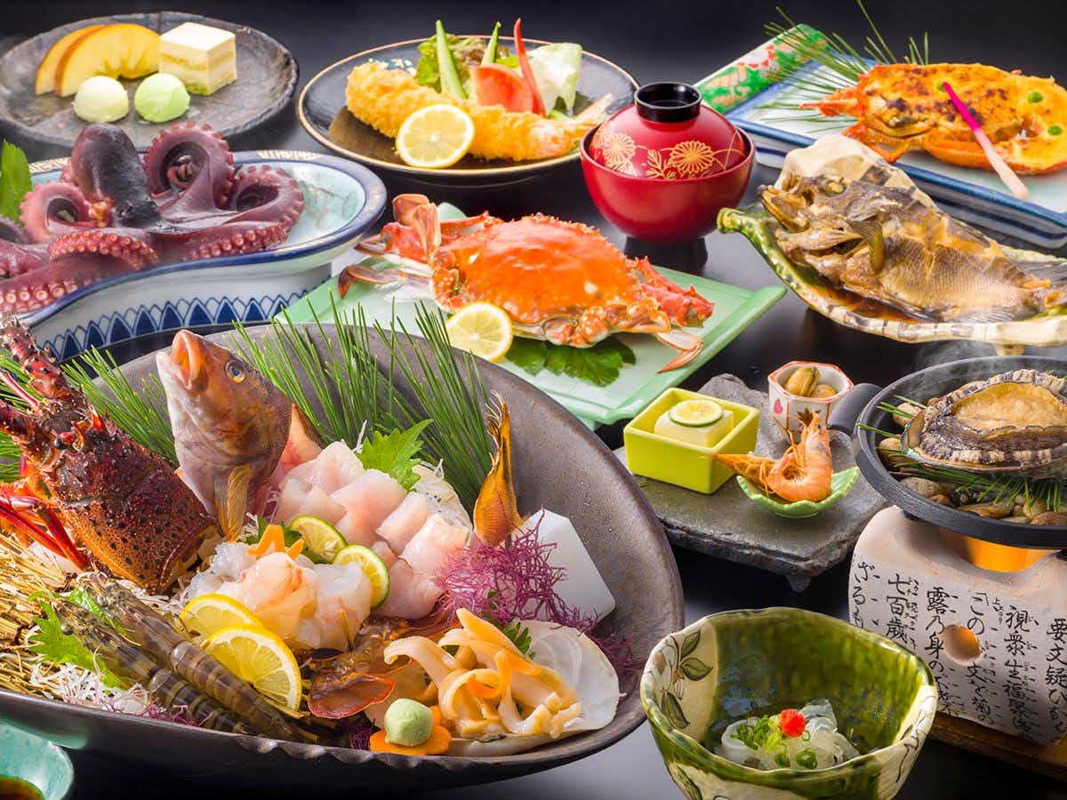 Kousuisou with a generous seafood banquet featuring crab, octopus, and sashimi.