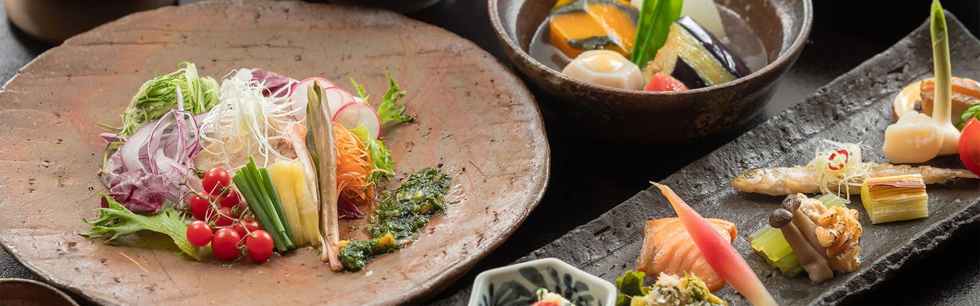 Hakkei with a colorful appetizer plate arranged with fresh seasonal vegetables.